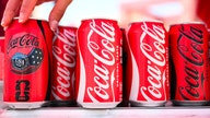 Coca-Cola's personalized cans show inconsistent enforcement against disallowing controversial phrases, groups