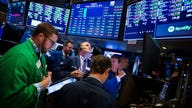 Dow closes above 48,000 for first time, 17th record close of 2025